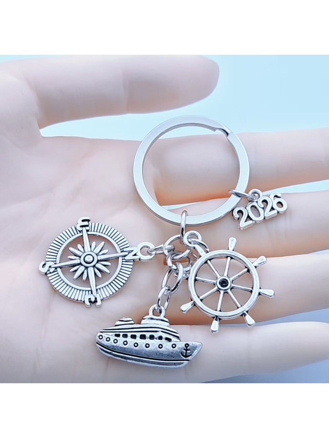 Close-up of alloy steamship shaped keychain with detailed deck and smokestacks