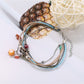 Lovra small bead alloy bracelet photographed with soft lighting on neutral background