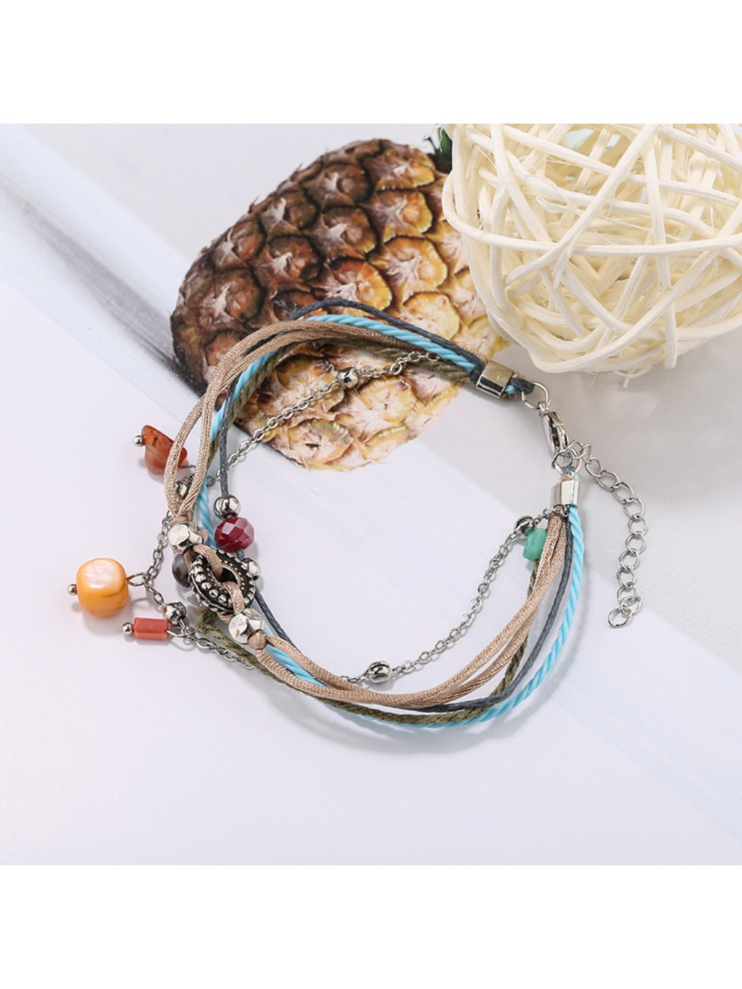 Lovra small bead alloy bracelet photographed with soft lighting on neutral background