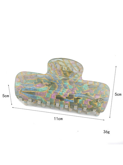Side view of Beau gradient acetate claw clip highlighting the metal spring mechanism