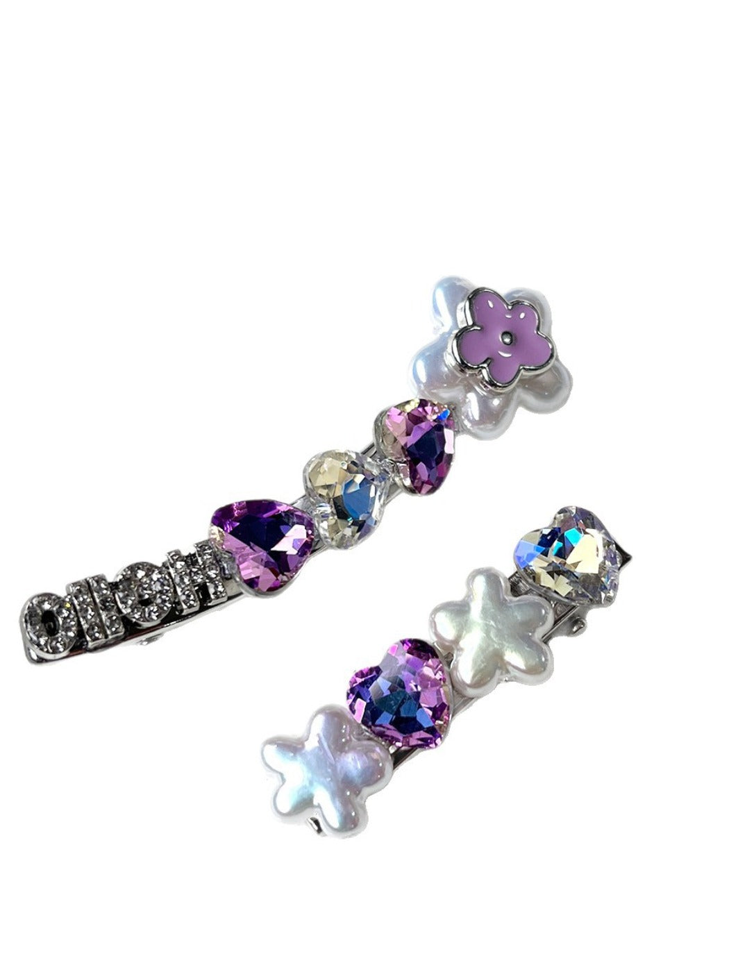 Beau rhinestone flower hair clip displayed on a flat surface with light reflections