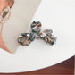 Beau bow hair claw clip clipped into thick brown hair