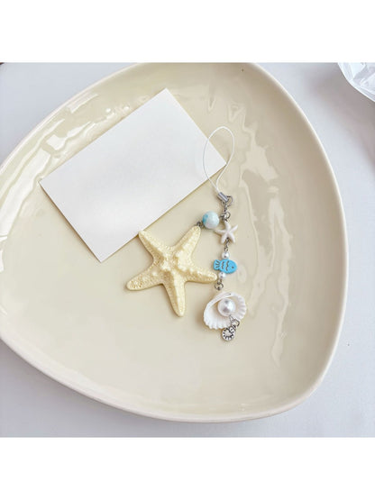 Ocean Starfish Little Fish keychain held in hand showing size and details