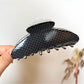 Beau polka dot acetate claw clip displayed with matching hair accessories