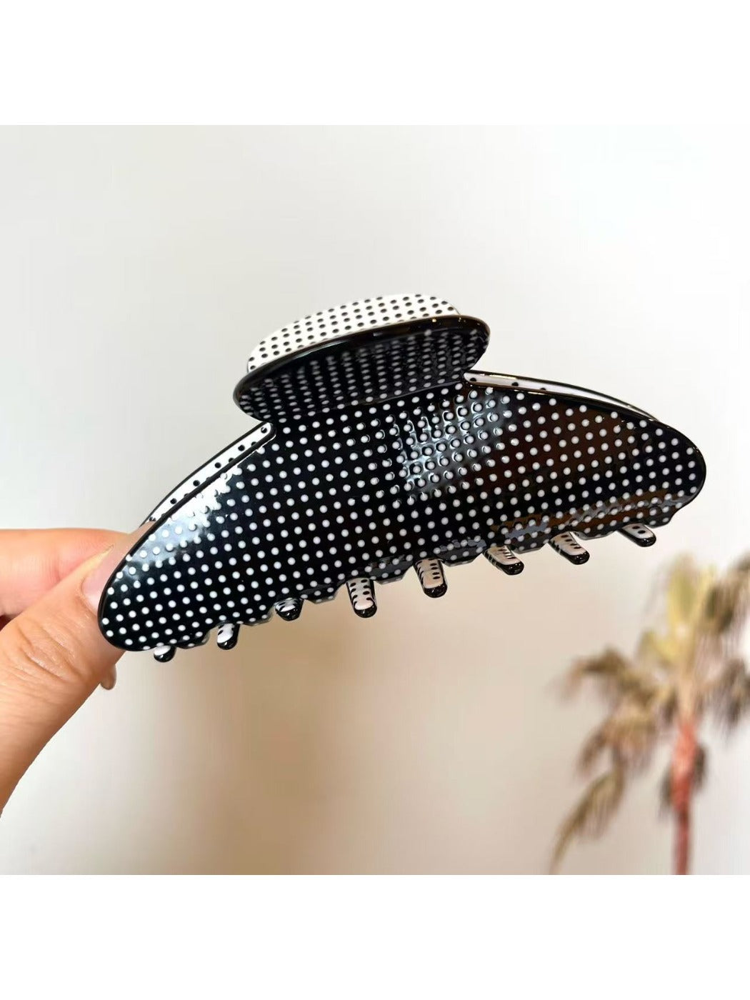 Beau polka dot acetate claw clip displayed with matching hair accessories