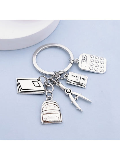 Side view of the alloy backpack book keychain highlighting the clasp