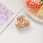 Beau fresh acetate hair clip photographed with complementary accessories