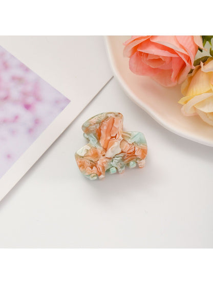 Beau fresh acetate hair clip photographed with complementary accessories