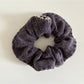 Multiple Gifty scrunchies displayed together showing variety in colors and patterns