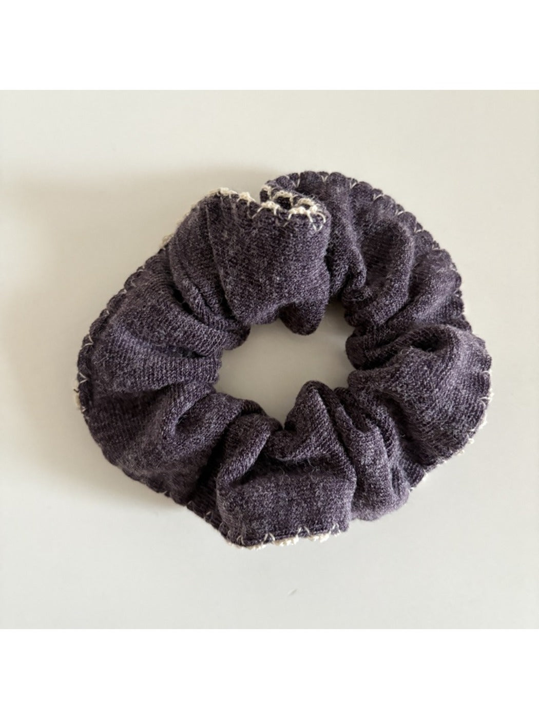 Multiple Gifty scrunchies displayed together showing variety in colors and patterns