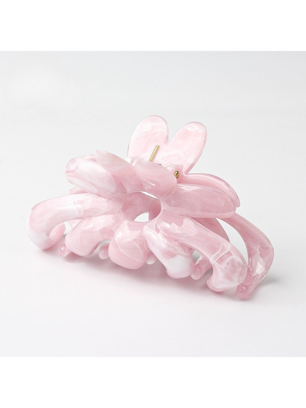 Beau flower hair clip held in hand showing size and detail