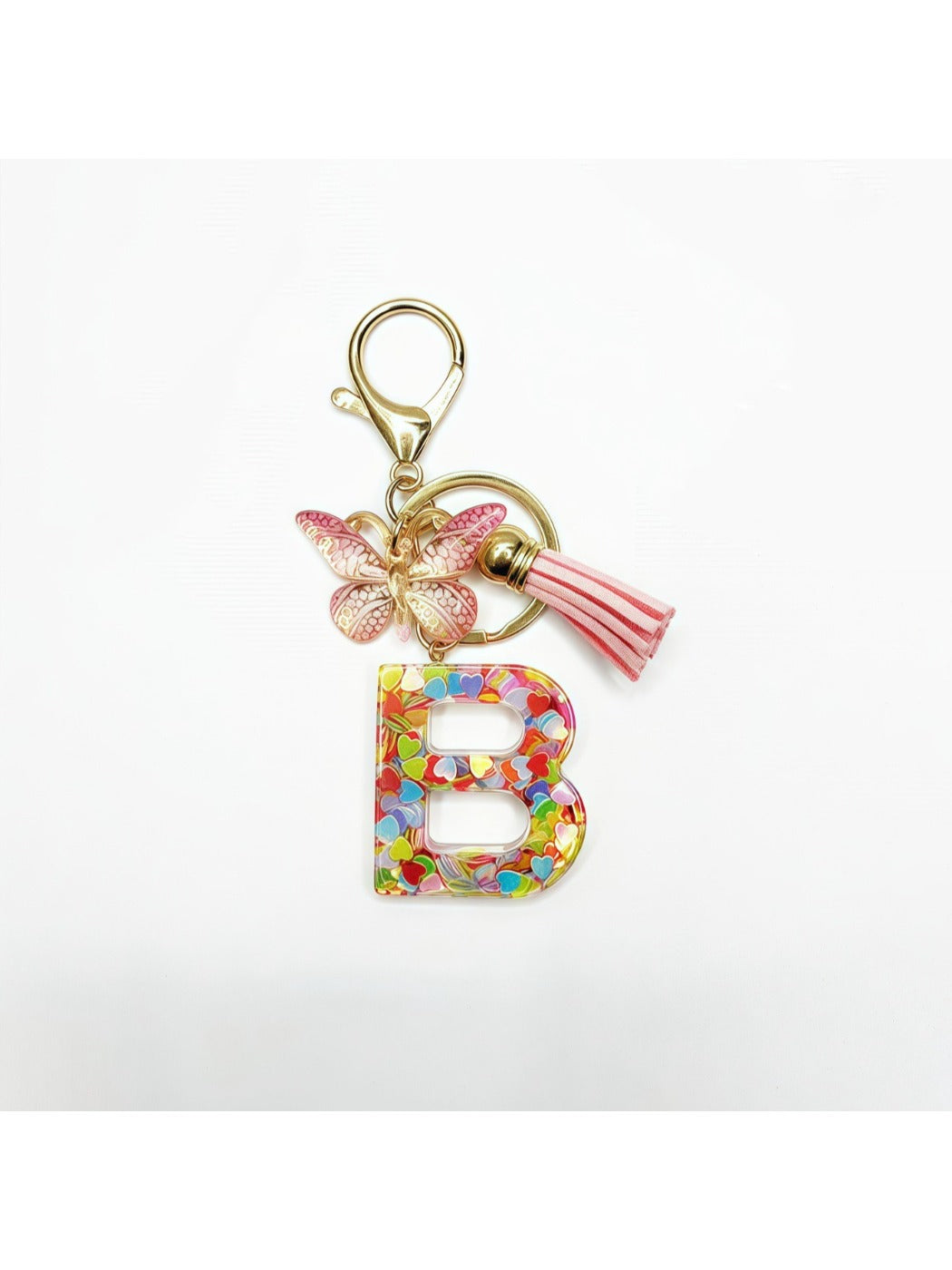 Butterfly letter pendant keychain hanging from a bag zipper