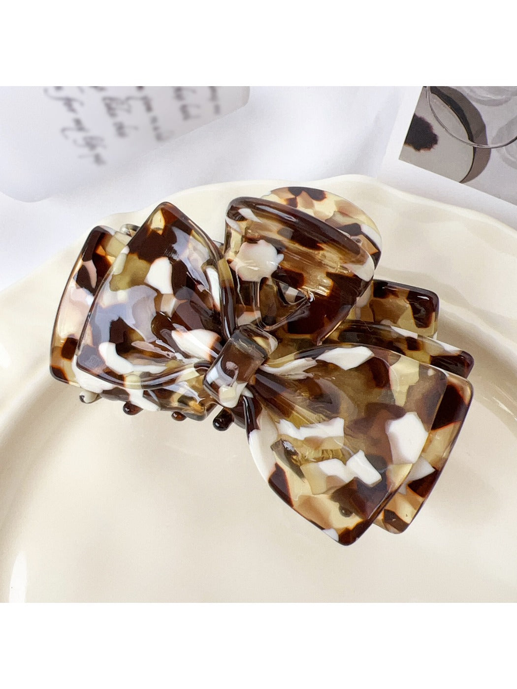 Beau claw clip displayed alongside matching hair accessories