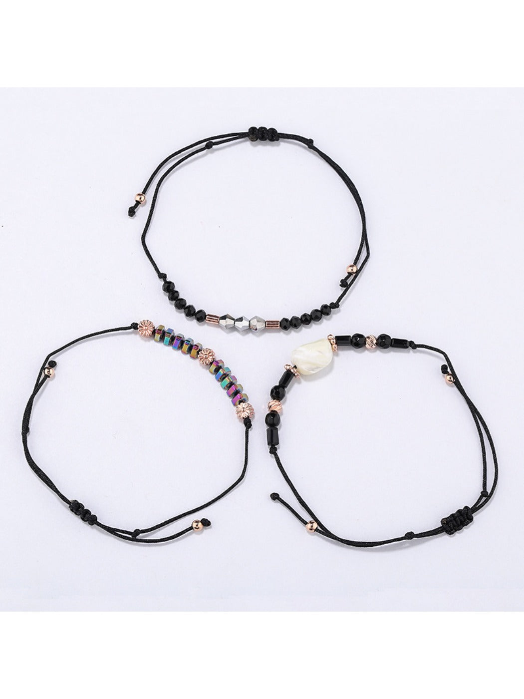 Lovra bracelet displayed flat showing detailed beadwork on woven black cord