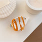 Beau colorful fish shaped claw clip photographed with natural lighting