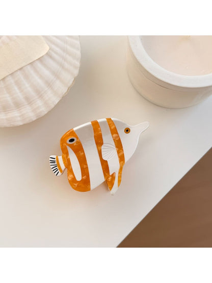 Beau colorful fish shaped claw clip photographed with natural lighting