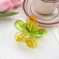Top view of Beau flower shaped claw clip showing symmetrical petal arrangement