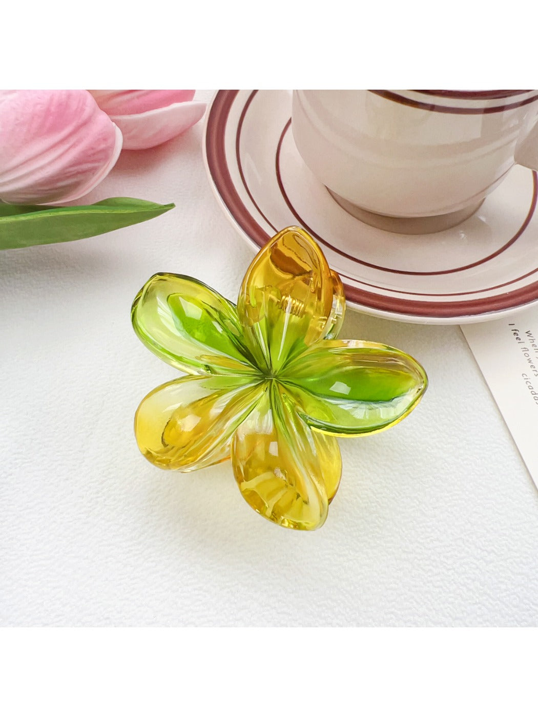 Top view of Beau flower shaped claw clip showing symmetrical petal arrangement