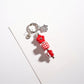 Keypus star-shaped keychain with vibrant beads shown from an angled perspective