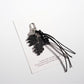 Multiple Keypus leaf shaped keychains in different colors displayed on white background