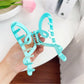 Side view of Beau color blocked heart shaped claw clip highlighting curved claw teeth