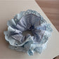 Gifty lace scrunchie styled with casual outfit, illustrating its versatile accessory appeal