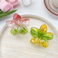 Side view of Beau classic colorful flower claw clip highlighting the clip mechanism