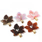 Side view of Beau leaf shaped hair clip clipped into blonde hair