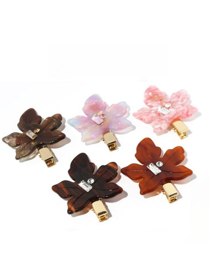 Side view of Beau leaf shaped hair clip clipped into blonde hair