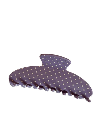 Beau hair clip styled in blonde hair with colorful polka dots visible