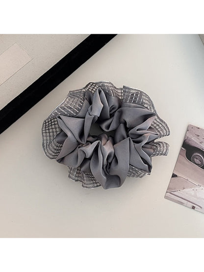 Flat lay of Gifty cut out ruched scrunchie on white background