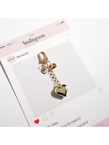 Keypus cute cartoon bag charm keychain shown in natural daylight