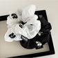 Side view of Gifty scrunchie highlighting elastic band and floral design