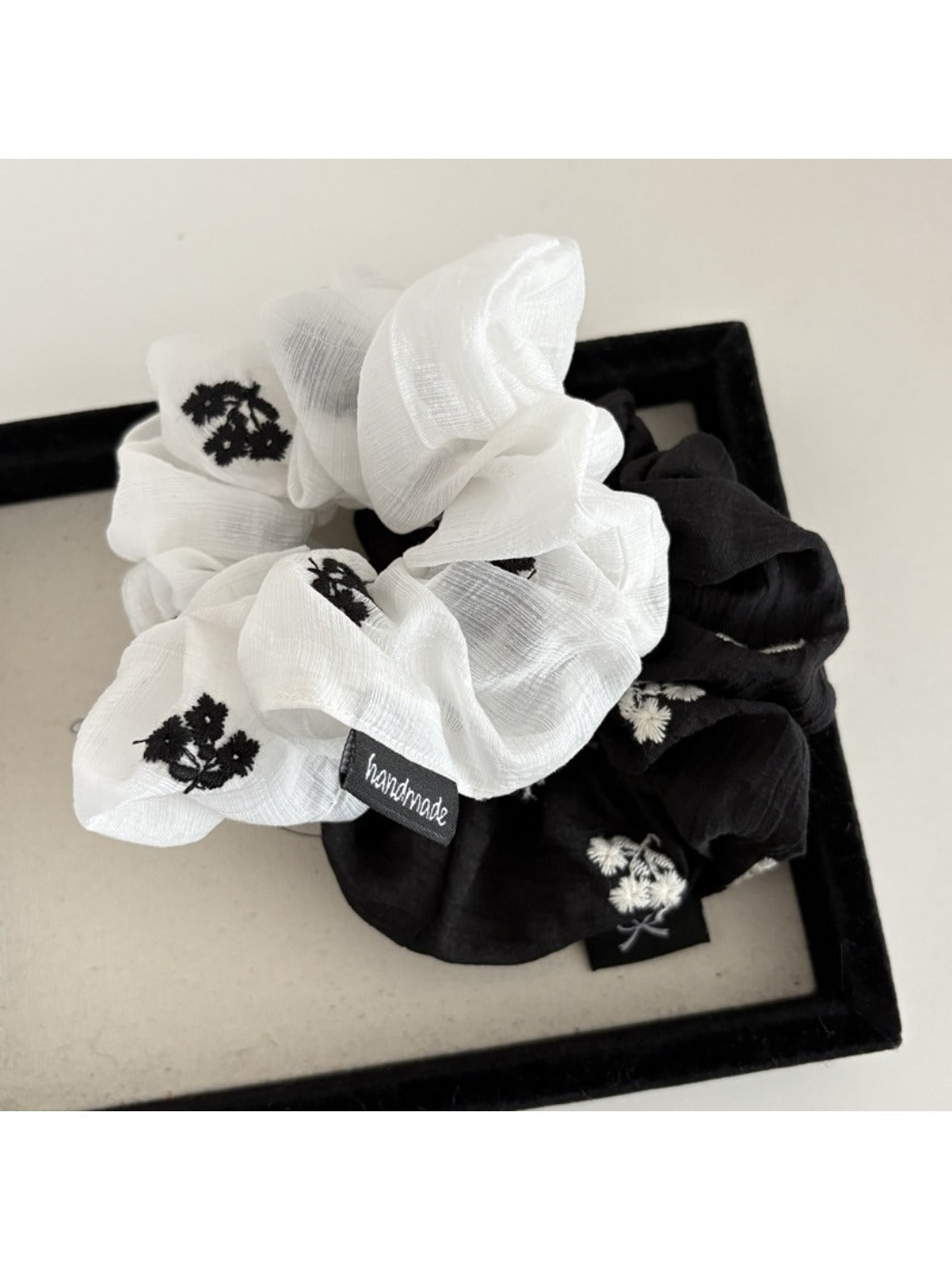 Side view of Gifty scrunchie highlighting elastic band and floral design