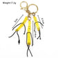 Mini French fries keychain on a keyring with a blurred background