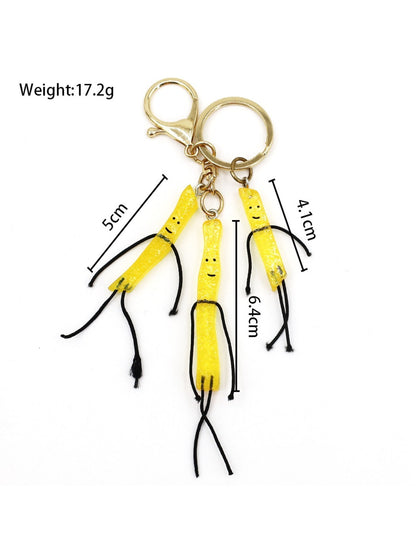 Mini French fries keychain on a keyring with a blurred background