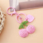 Multiple Keypus cherry charm keychains arranged in a row on a pastel background