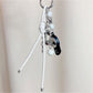 Baseball cap keychain displayed on a white background highlighting its shape and colors