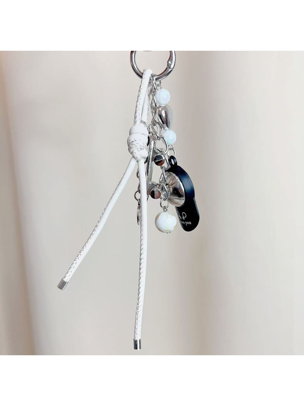 Baseball cap keychain displayed on a white background highlighting its shape and colors