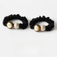 Gifty minimalist modern round bead hair tie in black on white background