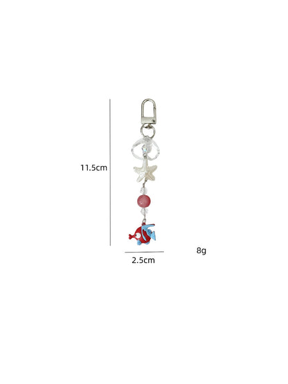 Collection of mini fish shaped keychains in multiple colors arranged in a row