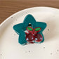 Beau star shaped hair claw clip styled in a half-up hairstyle