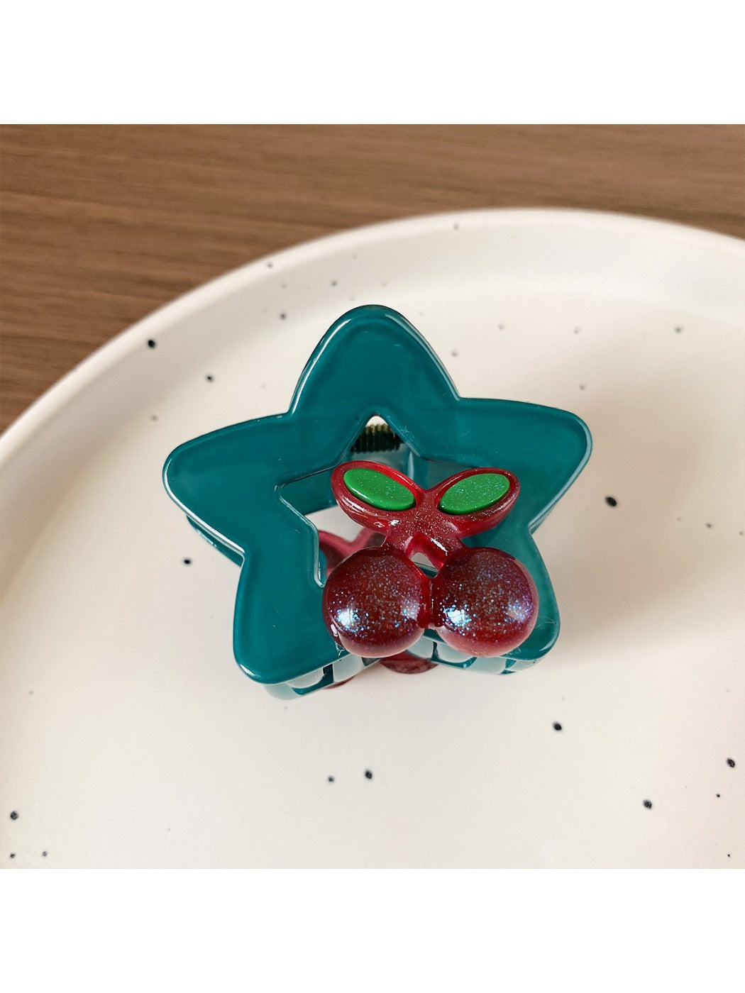 Beau star shaped hair claw clip styled in a half-up hairstyle