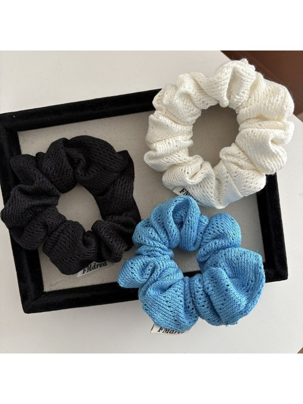 Gifty Lazy Style openwork scrunchie in beige fabric with intricate cutout design