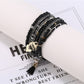 Side view of Lovra heart pendant bracelet showing bead arrangement and clasp