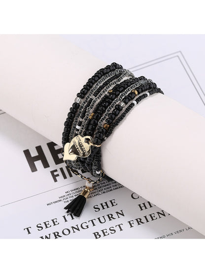 Side view of Lovra heart pendant bracelet showing bead arrangement and clasp
