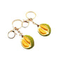 Top view of the durian keychain highlighting the keyring attachment