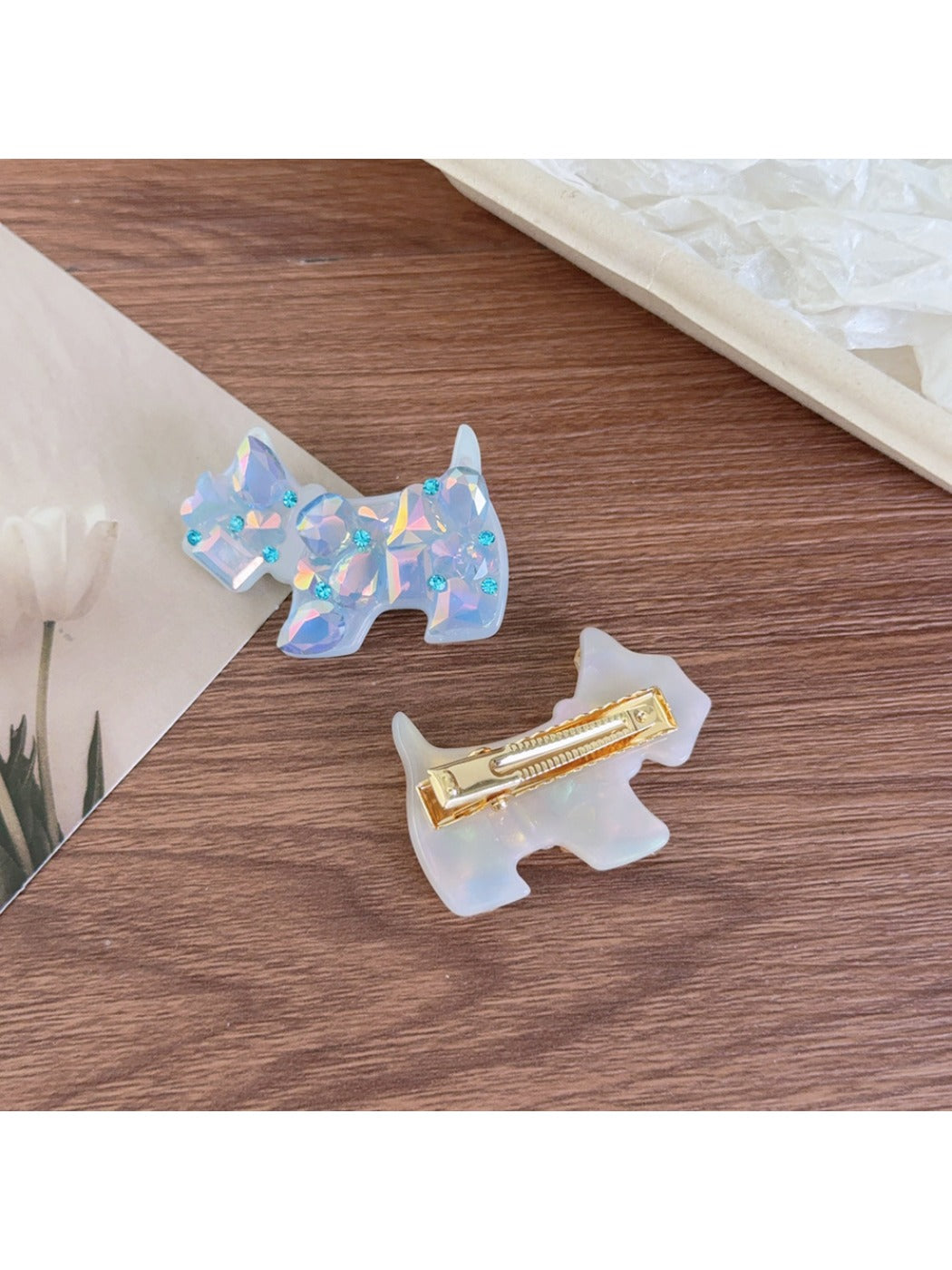 Close-up of Beau puppy hair clip showing smooth acetate texture and glossy finish