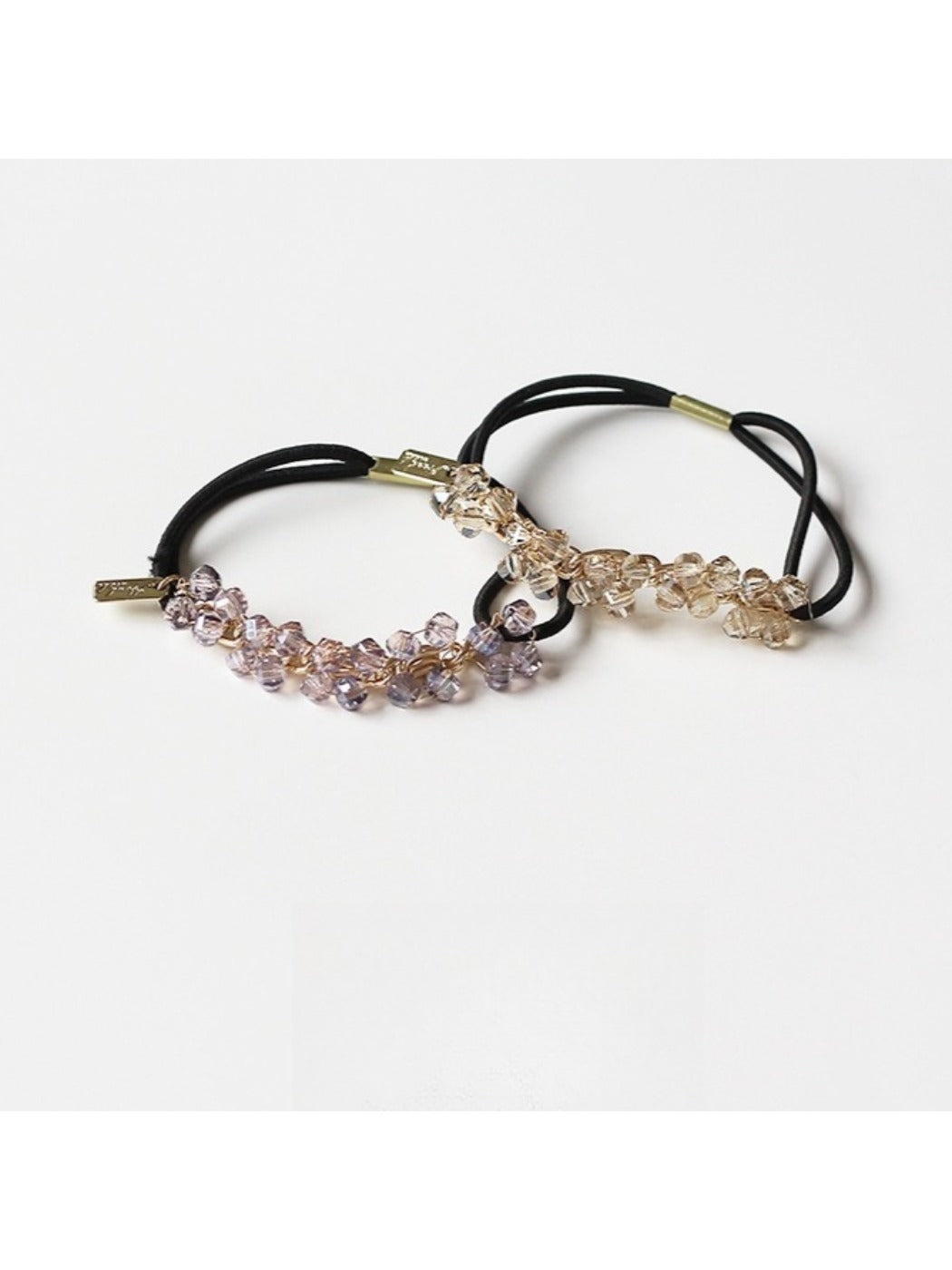 Side view of Gifty hair tie highlighting the arrangement of colorful beads on elastic