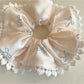 Gifty satin bow print scrunchie displayed on a white surface